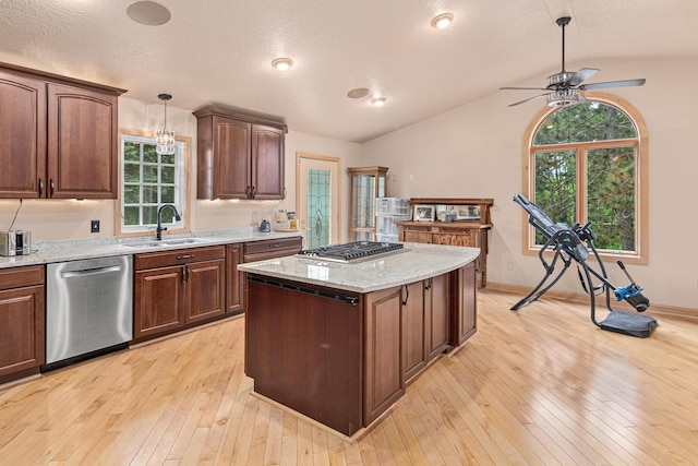 4480 253rd Ave NW, Isanti, MN 55040 - kitchen with stainless steel appliances, a sink, vaulted ceiling, a kitchen island, and ceiling fan