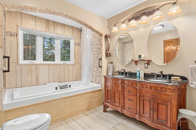 4480 253rd Ave NW, Isanti, MN 55040 - full bath featuring double vanity, tiled shower / bath combo, toilet, and tile patterned floors