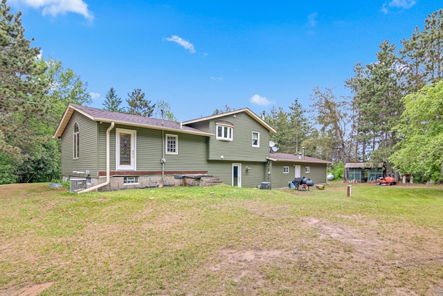 4480 253rd Ave NW, Isanti, MN 55040 - rear view of house with a lawn and cooling unit