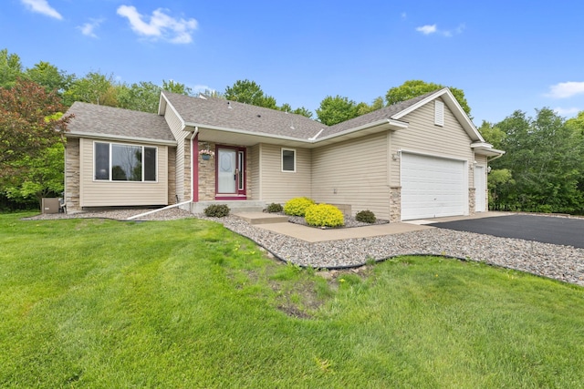 18358 Jenkins St NE, East Bethel, MN 55011 - single story home featuring stone siding, an attached garage, driveway, and a front lawn
