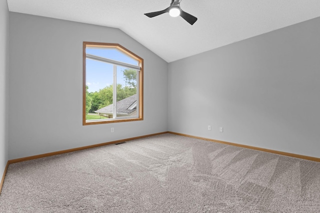 18358 Jenkins St NE, East Bethel, MN 55011 - carpeted empty room with vaulted ceiling, a ceiling fan, and baseboards
