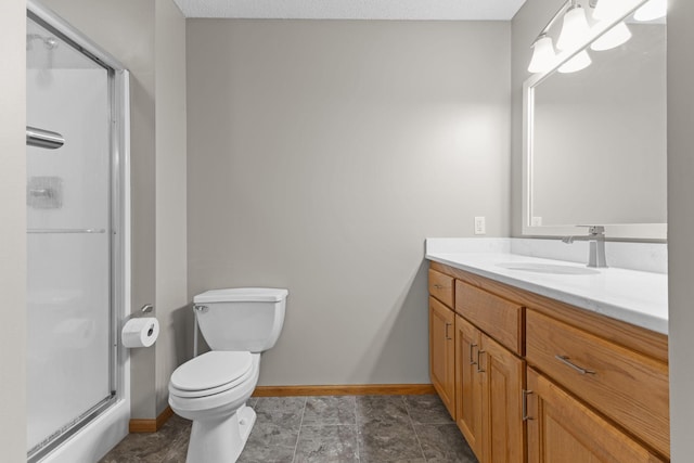 18358 Jenkins St NE, East Bethel, MN 55011 - full bathroom featuring baseboards, vanity, a stall shower, and toilet