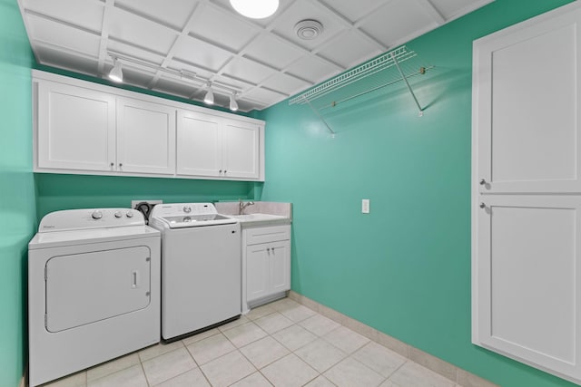 18358 Jenkins St NE, East Bethel, MN 55011 - washroom with cabinet space, independent washer and dryer, baseboards, and light tile patterned floors