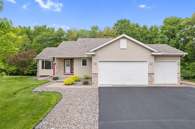 18358 Jenkins St NE, East Bethel, MN 55011 - ranch-style house featuring stone siding, a garage, asphalt driveway, a front yard, and roof with shingles