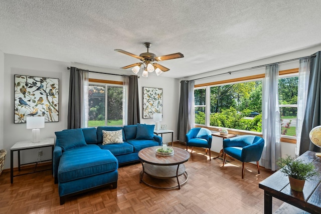 8170 113th St S, Cottage Grove, MN 55016 - living area with ceiling fan, a textured ceiling, and baseboards