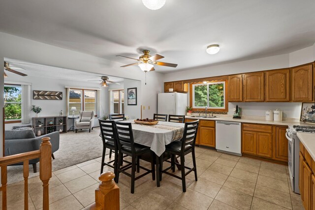 8170 113th St S, Cottage Grove, MN 55016 - kitchen featuring white appliances, a sink, brown cabinets, and a ceiling fan