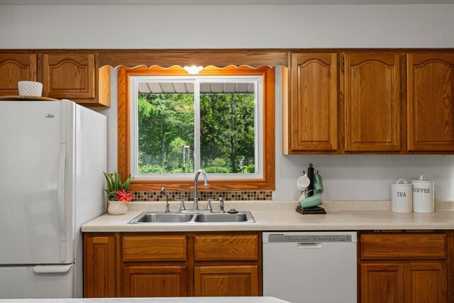 8170 113th St S, Cottage Grove, MN 55016 - kitchen featuring white appliances, a sink, light countertops, and brown cabinetry