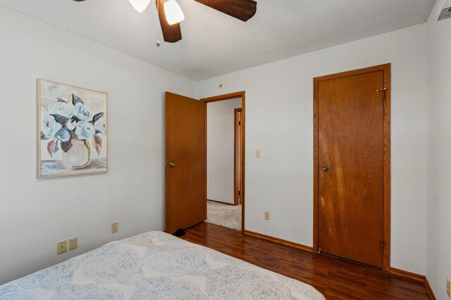 8170 113th St S, Cottage Grove, MN 55016 - bedroom featuring dark wood-style floors, baseboards, and ceiling fan