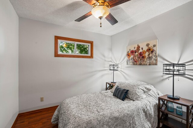8170 113th St S, Cottage Grove, MN 55016 - bedroom with wood finished floors, baseboards, a textured ceiling, and ceiling fan
