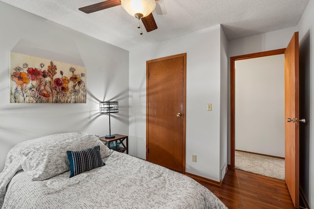 8170 113th St S, Cottage Grove, MN 55016 - bedroom featuring wood finished floors, baseboards, a textured ceiling, and a ceiling fan