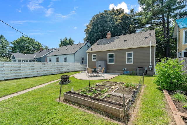 5749 Pleasant Ave S, Minneapolis, MN 55419 - back of house with a vegetable garden, central AC, a patio, and a chimney