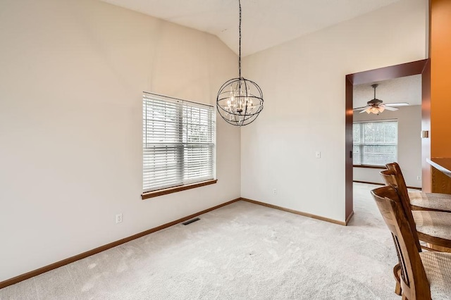 1059 Providence Dr, Shakopee, MN 55379 - unfurnished dining area with light colored carpet, baseboards, a chandelier, vaulted ceiling, and ceiling fan