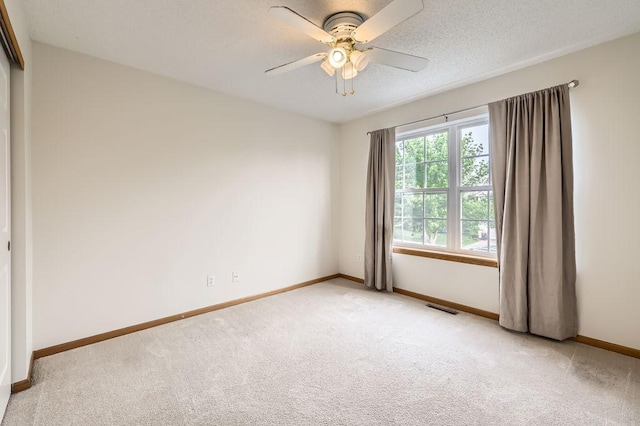 1059 Providence Dr, Shakopee, MN 55379 - unfurnished room with light colored carpet, baseboards, and ceiling fan