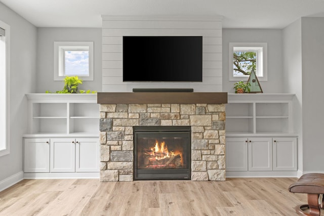 7137 61st St S, Cottage Grove, MN 55016 - unfurnished living room with wood finished floors, a fireplace, and baseboards