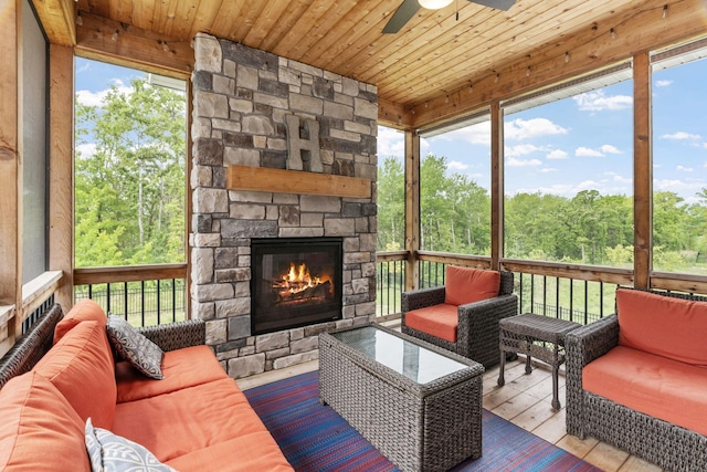 7137 61st St S, Cottage Grove, MN 55016 - sunroom / solarium featuring an outdoor living space with a fireplace and ceiling fan