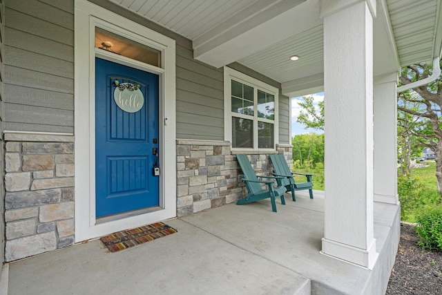7137 61st St S, Cottage Grove, MN 55016 - property entrance featuring stone siding and a porch