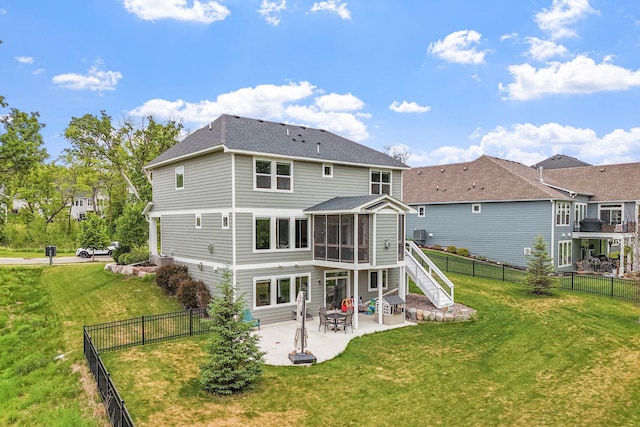 7137 61st St S, Cottage Grove, MN 55016 - back of house with a sunroom, a patio, roof with shingles, and stairway