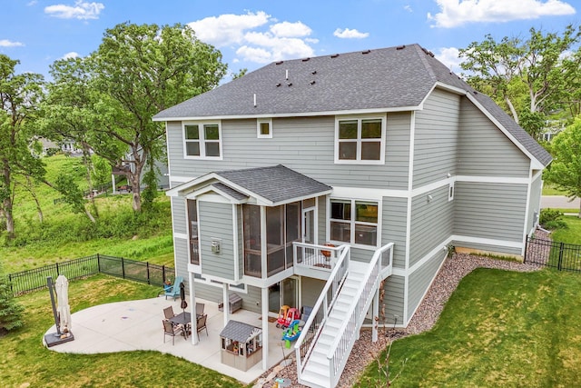 7137 61st St S, Cottage Grove, MN 55016 - back of property featuring a sunroom, a shingled roof, a patio, and stairway
