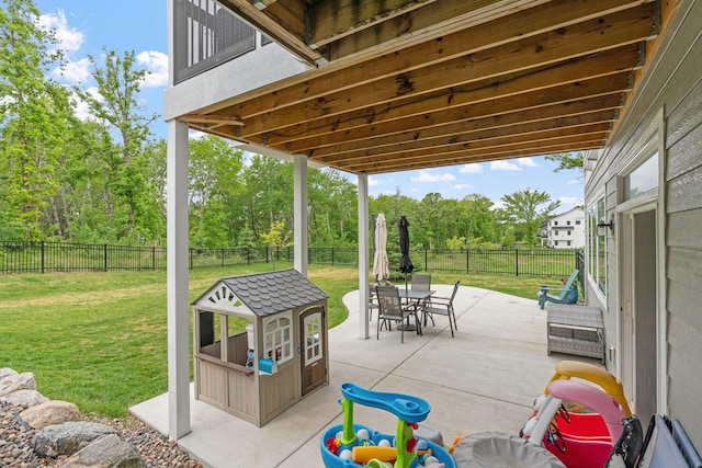 7137 61st St S, Cottage Grove, MN 55016 - view of patio / terrace with outdoor dining area and view of scattered trees