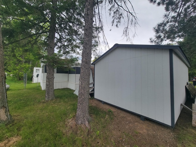 32360 215th Ln Lot A1, Isle, MN 56342 - view of home's exterior with a lawn and an outdoor structure