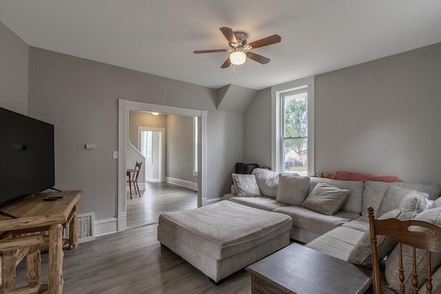 202 Adams St, Arlington, MN 55307 - living area featuring ceiling fan, wood finished floors, and baseboards