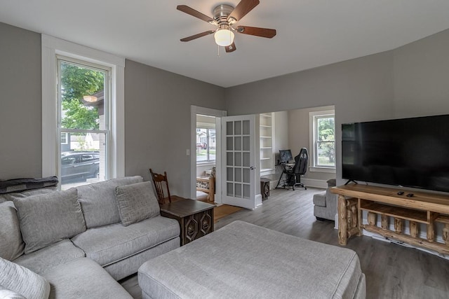 202 Adams St, Arlington, MN 55307 - living room featuring wood finished floors, a desk, ceiling fan, and french doors