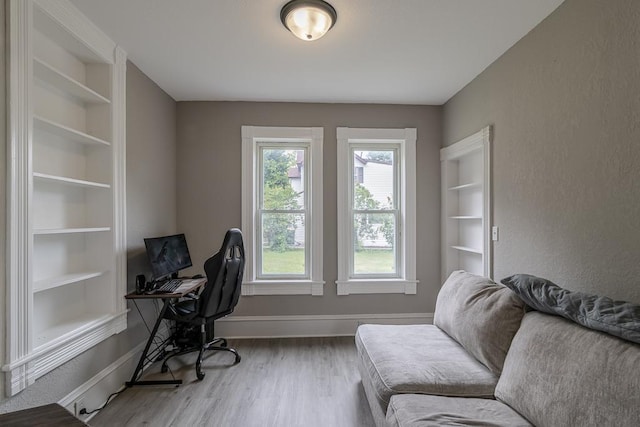 202 Adams St, Arlington, MN 55307 - home office with wood finished floors, baseboards, and built in features