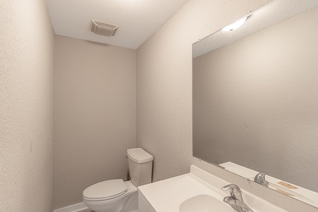 202 Adams St, Arlington, MN 55307 - half bathroom featuring toilet and vanity