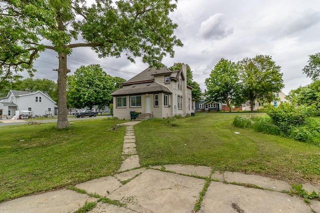 202 Adams St, Arlington, MN 55307 - back of house featuring a lawn, a chimney, roof with shingles, and brick siding