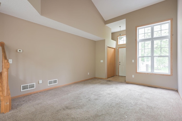 3003 Cutters Grove Ave, Anoka, MN 55303 - empty room featuring carpet, baseboards, and high vaulted ceiling