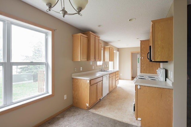 3003 Cutters Grove Ave, Anoka, MN 55303 - kitchen with white appliances, a chandelier, light countertops, a sink, and baseboards