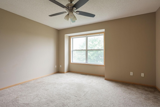 3003 Cutters Grove Ave, Anoka, MN 55303 - empty room with light carpet, a ceiling fan, baseboards, and a textured ceiling