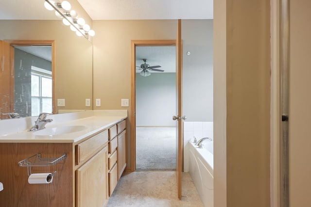 3003 Cutters Grove Ave, Anoka, MN 55303 - full bathroom with vanity, a garden tub, ceiling fan, and tile patterned floors