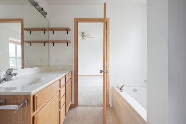 3007 Cutters Grove Ave, Anoka, MN 55303 - bathroom featuring vanity, a bath, a ceiling fan, and tile patterned flooring