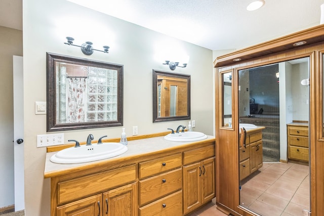 816 Glenbrook Ave N, Oakdale, MN 55128 - bathroom featuring double vanity and tile patterned floors