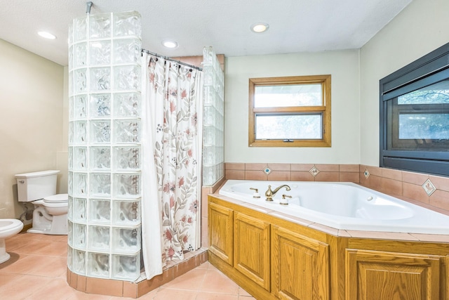 816 Glenbrook Ave N, Oakdale, MN 55128 - bathroom with toilet, a bidet, a tile shower, a bath, and recessed lighting