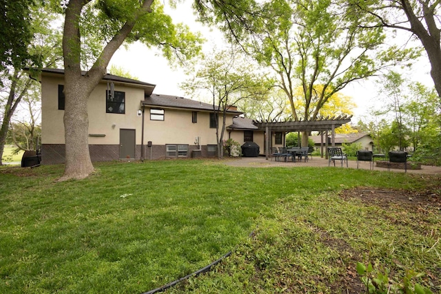 816 Glenbrook Ave N, Oakdale, MN 55128 - rear view of house featuring a pergola, a lawn, stucco siding, and a patio area