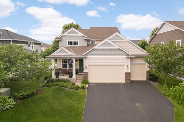 11736 Ivywood Trl, Woodbury, MN 55129 - craftsman inspired home featuring brick siding, a porch, a front lawn, and driveway