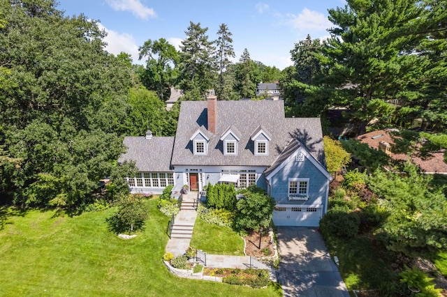 14 Forest Dale Rd, Minneapolis, MN 55410 - cape cod home with a garage, a chimney, driveway, stairway, and a front yard