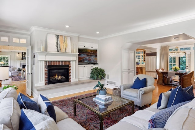 14 Forest Dale Rd, Minneapolis, MN 55410 - living room with a brick fireplace, wood finished floors, ornamental molding, and recessed lighting