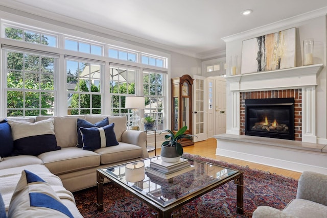 14 Forest Dale Rd, Minneapolis, MN 55410 - living room with crown molding, wood finished floors, a fireplace, and recessed lighting