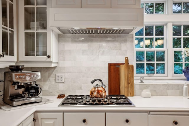 14 Forest Dale Rd, Minneapolis, MN 55410 - kitchen featuring custom range hood, white cabinetry, light countertops, and glass insert cabinets