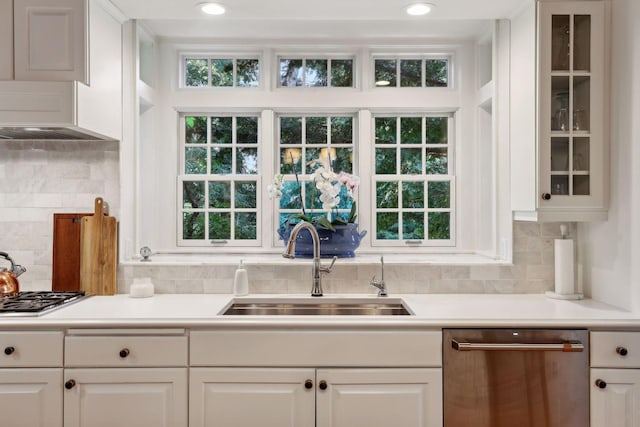 14 Forest Dale Rd, Minneapolis, MN 55410 - kitchen featuring stainless steel appliances, a sink, white cabinets, and glass insert cabinets