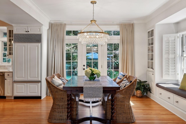 14 Forest Dale Rd, Minneapolis, MN 55410 - dining space featuring a chandelier, light wood-type flooring, crown molding, and french doors