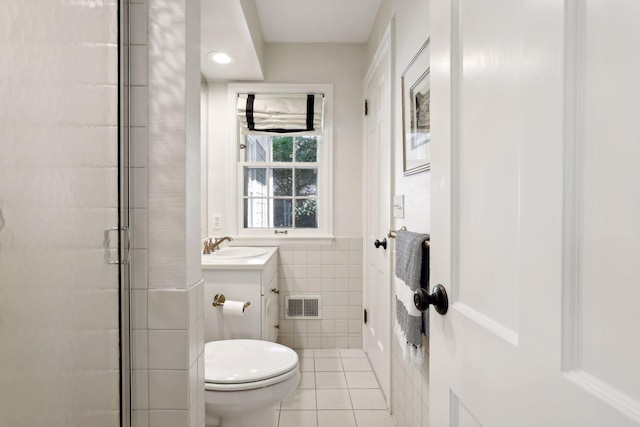 14 Forest Dale Rd, Minneapolis, MN 55410 - full bath with toilet, a stall shower, tile patterned floors, vanity, and tile walls