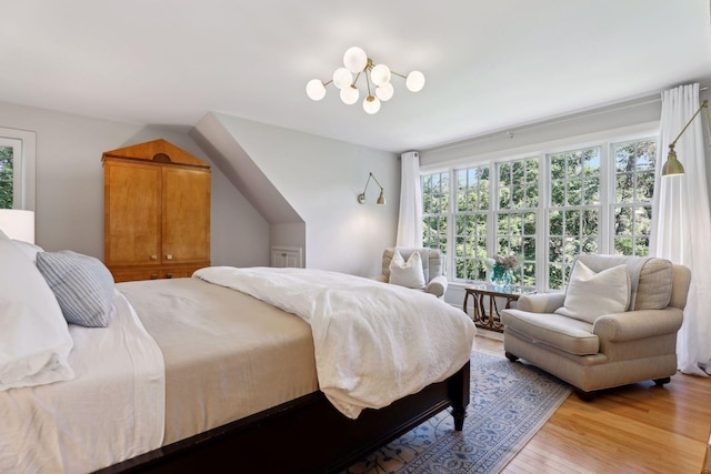 14 Forest Dale Rd, Minneapolis, MN 55410 - bedroom with light wood-style flooring and a chandelier