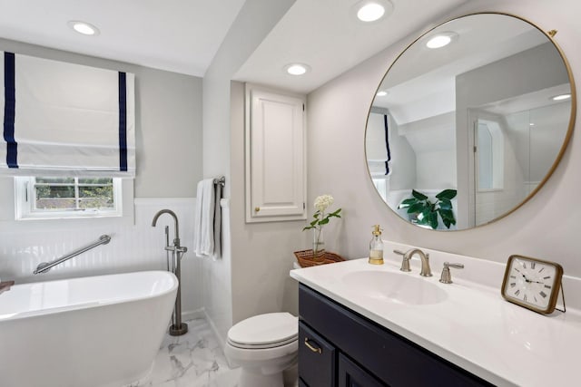 14 Forest Dale Rd, Minneapolis, MN 55410 - bathroom featuring marble finish floors, a freestanding bath, vanity, wainscoting, and recessed lighting