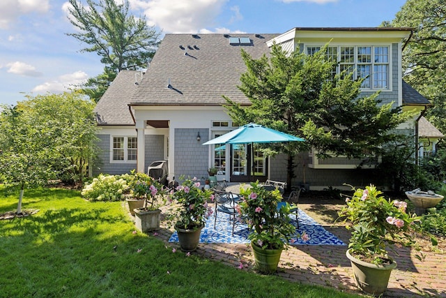 14 Forest Dale Rd, Minneapolis, MN 55410 - rear view of property with a patio area, a yard, and roof with shingles