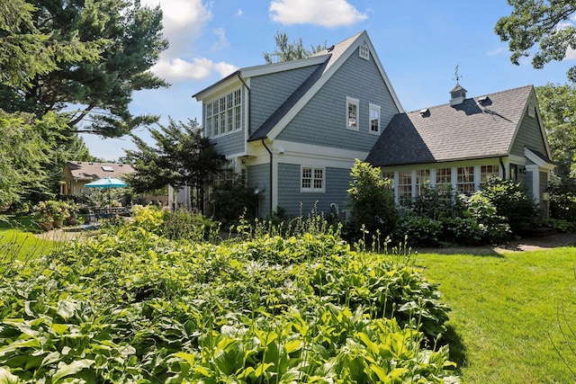 14 Forest Dale Rd, Minneapolis, MN 55410 - view of property exterior featuring a shingled roof and a yard