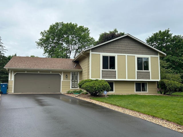 3476 116th Ln NW, Coon Rapids, MN 55433 - tri-level home featuring driveway, an attached garage, and a front lawn